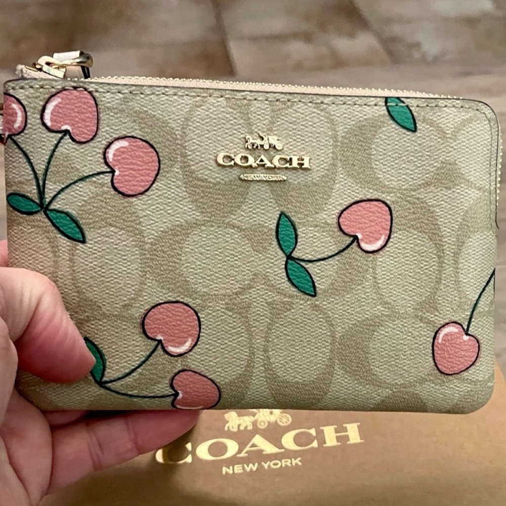 Coach cherry print 🍒. Never used . Bought off Poshmark selling not my style .